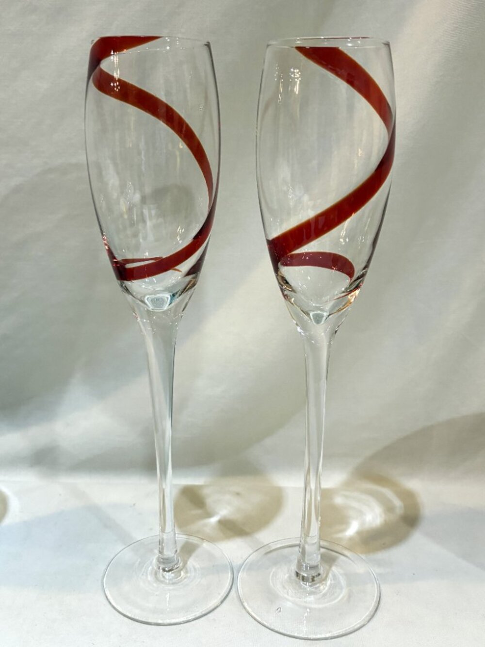 Pair of Pier 1 One Red Swirled Champagne Flutes Wine Glasses